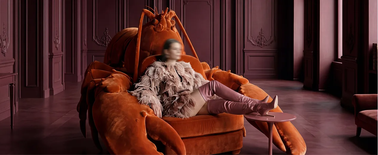 Woman in fur jacket sitting on an orange armchair in a dramatic interior — personal brand confidence visual